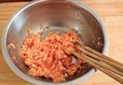 杏鲍菇猪肉包子,将肉馅放进干净的容器内,打一枚<a style='color:red;display:inline-block;' href='/shicai/ 9'>鸡蛋</a>进去,然后用筷子顺着一个方向搅至肉馅上劲。
