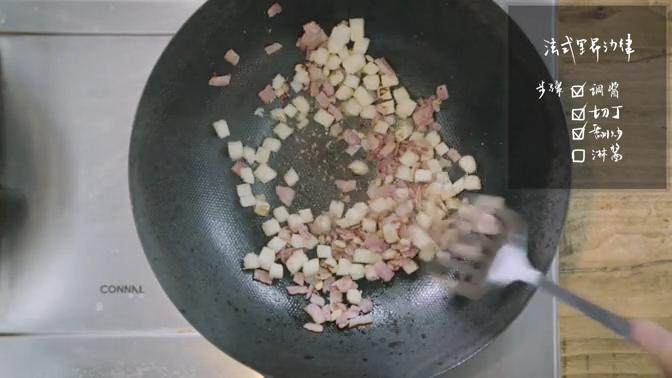 法式里昂沙律&鸡肉卷饼,取炒锅烧热翻炒培根,加入吐司块、<a style='color:red;display:inline-block;' href='/shicai/ 677'>松子仁</a>,最后倒入橄榄油翻炒