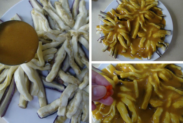 花开富贵:咖喱菊花茄子 ,咖喱汁淋在茄子上,在花心的位置放上红椒粒,在旁边点缀几片<a style='color:red;display:inline-block;' href='/shicai/ 131'>香菜</a>叶即可