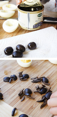 跟孩子做惊悚又美味的蜘蛛蛋——Spider Eggs ,黑橄榄切半,有一半留着作为蜘蛛的body,另一半,用小刀轻轻纵向切成八等份,作为蜘蛛的脚。