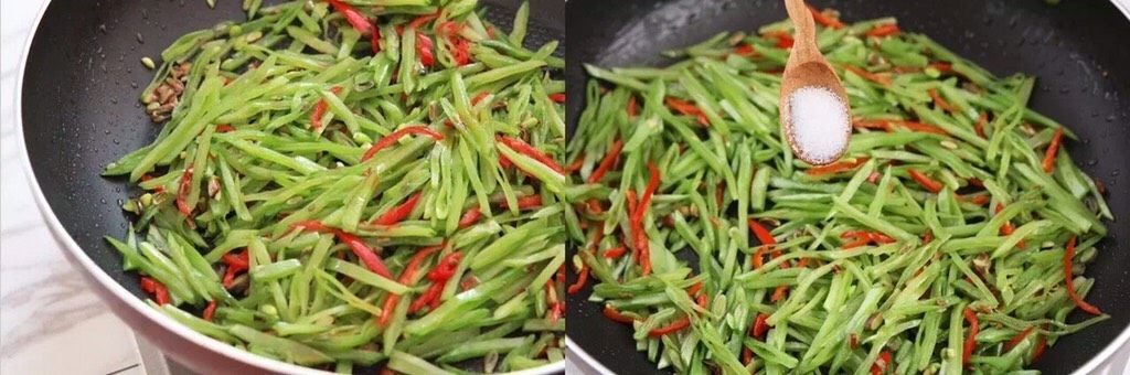 一道简单的不能再简单的小炒,竟然这么好吃!,将扁豆与辣椒翻炒均匀,炒至扁豆丝八分熟加入一勺盐调味
