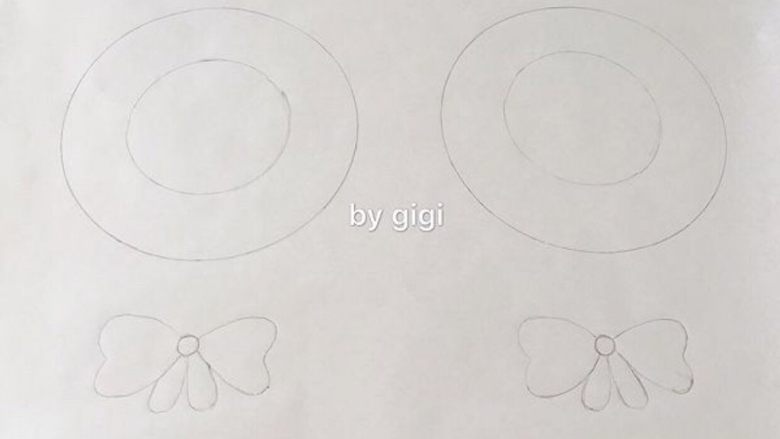 圣诞花环蛋白糖,准备一张烘焙纸 如图画两個圆和蝴蝶结🎀