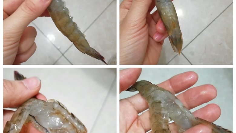 蒜蓉粉丝虾,找一把剪刀,先把虾须和虾脚剪掉,再沿着虾头对半剪开至虾尾大约第二节处,去掉虾线和虾囊(图中的脏东西)。这样处理后的虾,连头也是可以吃的。而且一只虾摆起来像两只虾,快说我是不是特别勤俭持家?!