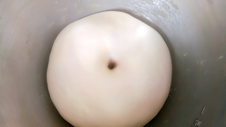 椰蓉小餐包,面团发至2倍大,手指粘面粉在面团中间戳个洞,不回缩不塌陷证明已经发酵好了。