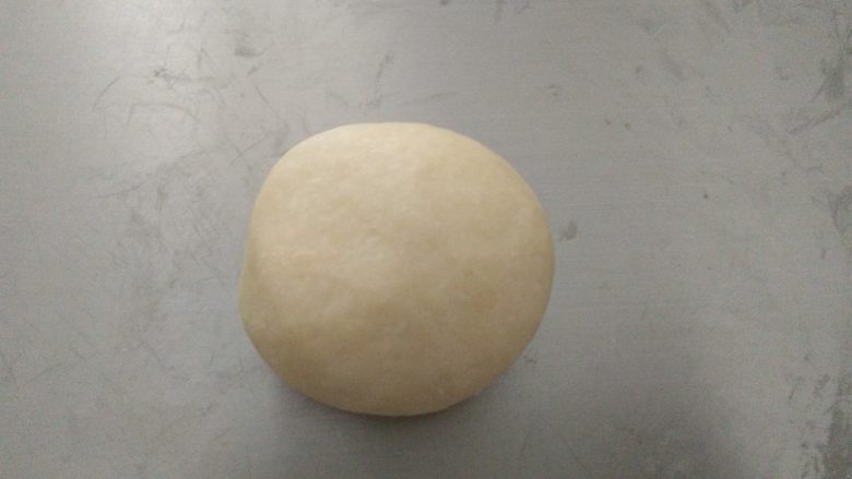 香葱苏打饼干,
把油酥包裹起来,收口朝下放置