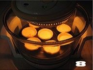 美味蛋挞速成法--【椰丝蛋挞】,先用175度烤制10分钟左右,再把光波锅调节到200度烤5分钟上色。