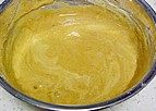 奶油咖啡戚风蛋糕,再取1/3的蛋白霜,加入到步骤11的面糊中,用刮刀从底部捞起,将面糊拌