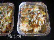 南瓜奶香绞纹意面,送入预热好180℃的烤箱，烤至表现芝士融化即可